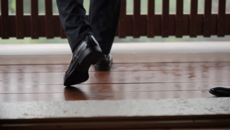 business man wearing black classic formal shoes walking with confidence