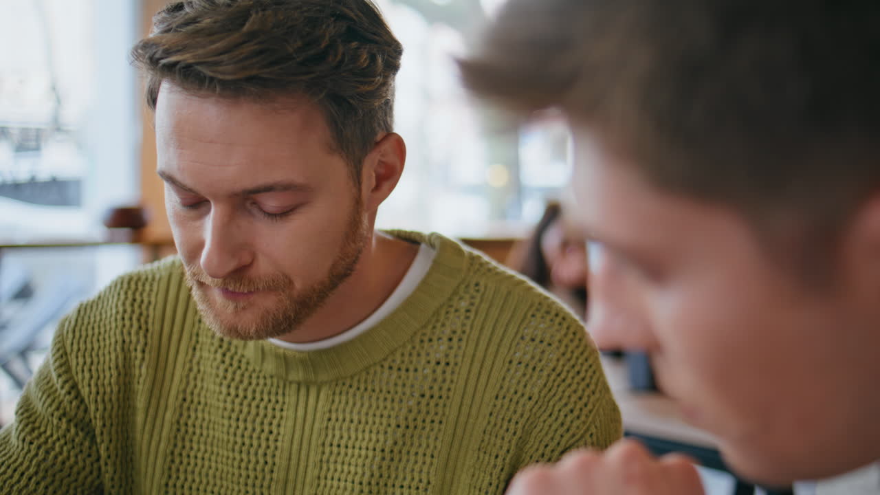 Startup people discussing project at coworking closeup. Men talking together