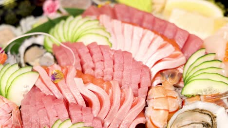 assorted sushi and seafood displayed on a platter