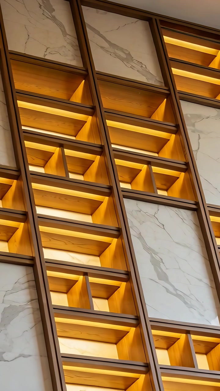 Vertical video: Sweeping camera showing wood cubby wall in lobby, showcasing warm LED marble panels