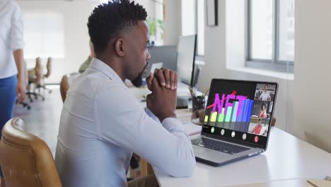 African-american-businessman-using-laptop-for-video-call-with-diverse-business-colleagues