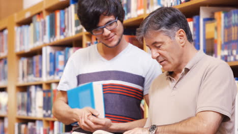 teacher and student discussing over a book