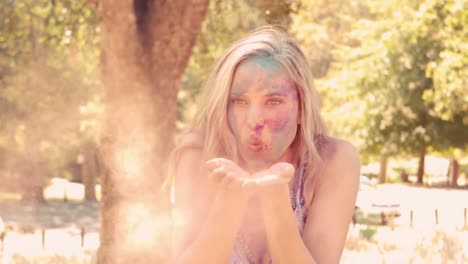 young woman having fun with powder paint