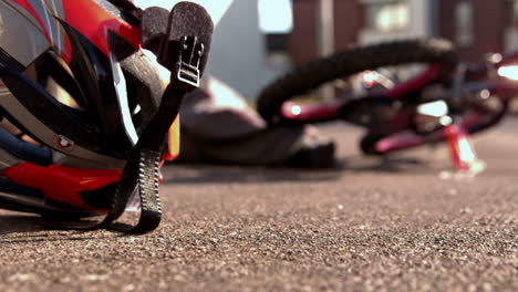 bike helmet falling on the path after an accident