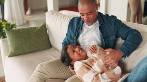 home, family and dad tickle in living room