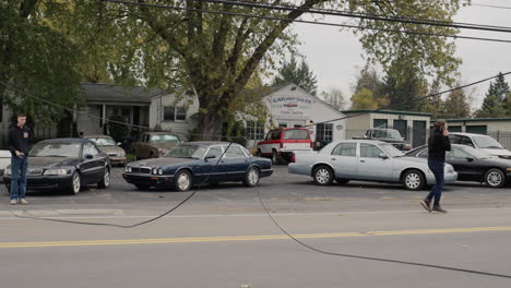 clarence, ny, usa, october 2021: cars bypass the break in the power supply cable, volunteers regulate traffic