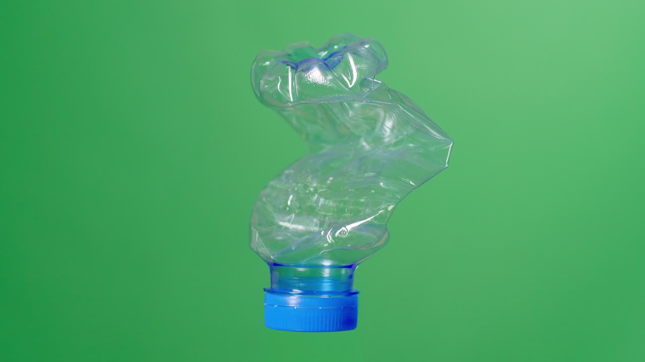 Plastic Crushed Water Bottle On Green Screen Background
