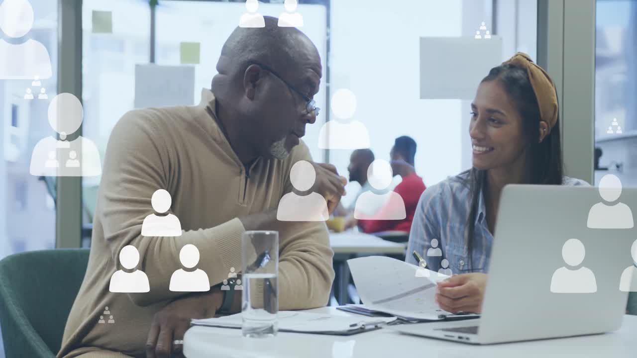 Animation of icons over diverse business people