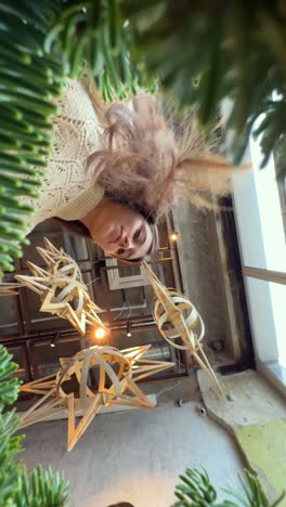 woman looking at christmas decorations