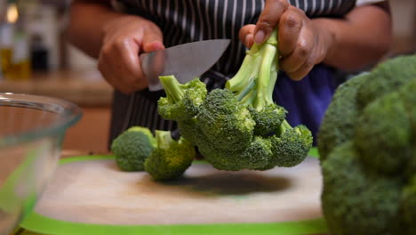 Cutting-a-broccoli-rabe-or-head-into-pieces-for-a-healthy,-homemade-meal---slow-motion