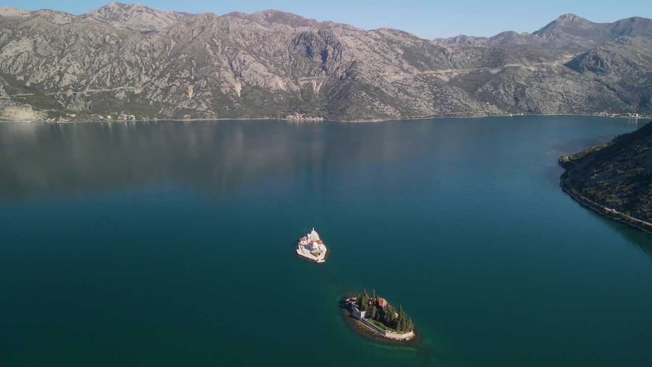 Beautiful aerial of Bay of Kotor with the two famous islets against view of the mountains