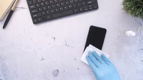 cleaning a smartphone and other office supplies