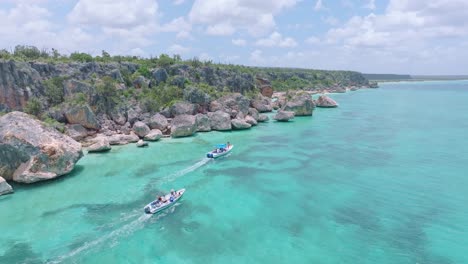 two yachts with tourist visiting coastline of bay de las aguilas in pedernales