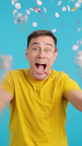 man celebrating with confetti