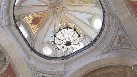 chandelier and dome ceiling inside bom jesus do monte church in braga, portugal