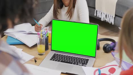 Composition-of-diverse-students-on-laptop-online-learning-with-green-screen