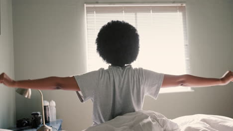 Bed,-sleep-and-stretching-by-black-woman-waking-up