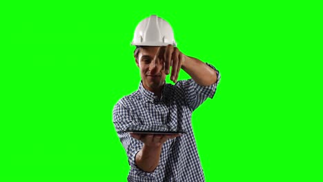 Front-view-of-site-worker-holding-a-digital-tablet-with-green-screen
