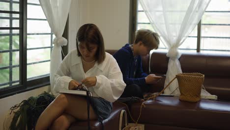 people engaging in crafts and leisure activities indoors