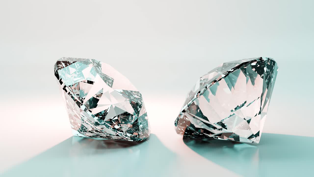 Due diamanti scintillanti che riflettono la luce su sfondo bianco