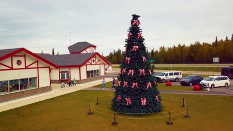 4k drone video of christmas tree at santa claus house in north pole, alaksa during summer day