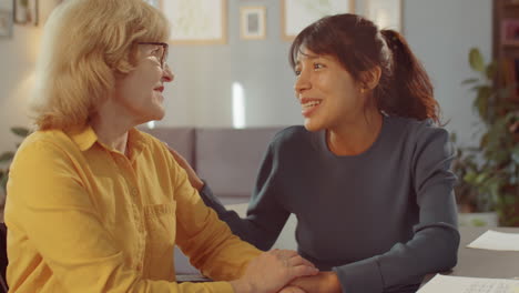 young woman chatting with grandmother