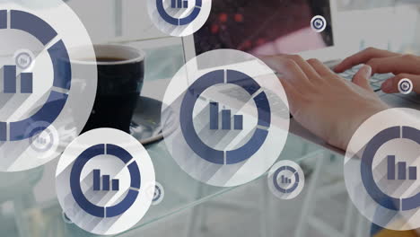 animación de iconos gráficos sobre taza de café y manos recortadas de una mujer caucásica trabajando en una computadora portátil