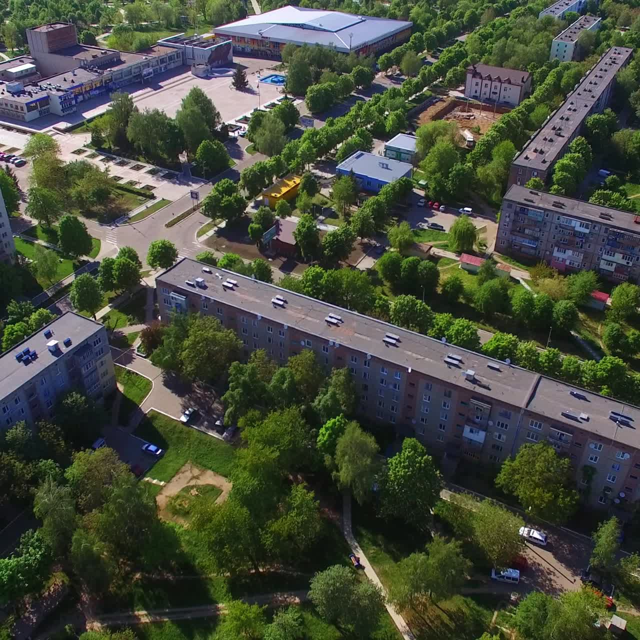 Long blocks of flats in the residential area. Green quarters with multi-storied buildings in Ukrainian city