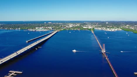 aerial view of csx train bridge, palmetto fishing pier, manatee river bridge and palmetto city from bradenton, florida, usa