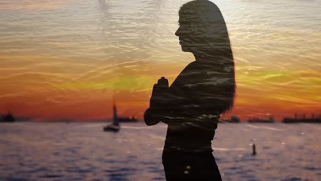 silhouette of a woman beside an ocean