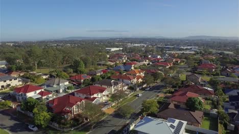 gliding aerial drone shot, flying over a a typical quiet australian suburb