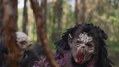 scary demons look for lost travelers in forest closeup