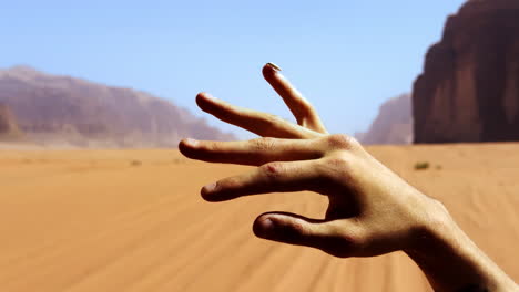 hand in the wadi rum desert