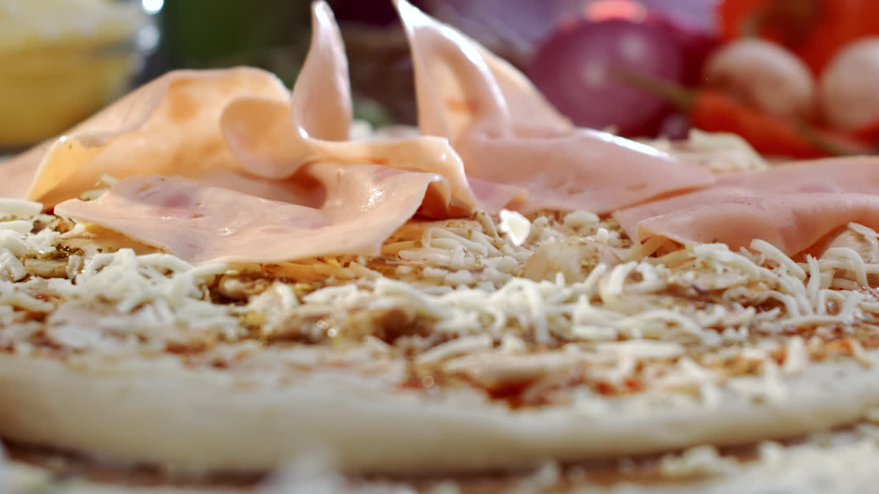 Pizza preparation with ham and cheese