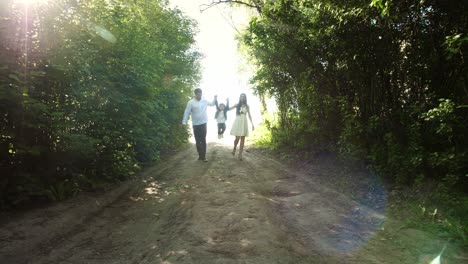 family enjoying a walk in the forest