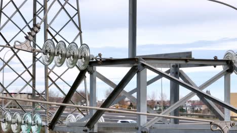 Transmission-tower-components-and-assembly,-aerial-close-up-view