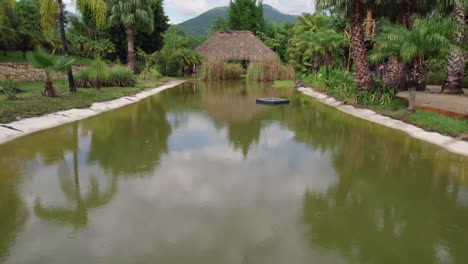 Tranquil-Oaxaca-villa-landscape,-Villa-de-Etla,-mountains-backdrop,-Mexico---Aerial-fast-fly-over