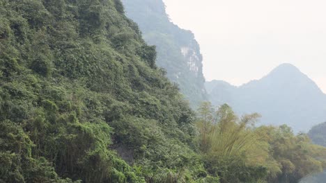 boat ride through lush, mountainous landscape