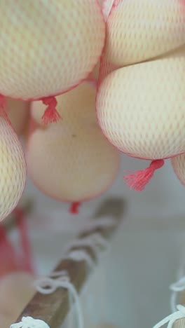 hanging cheese in net bags