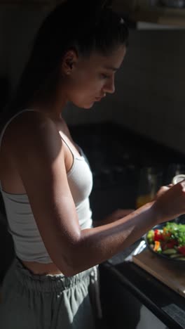 woman preparing a salad in the kitchen