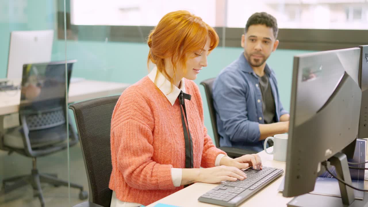 Colleagues working happily together in a coworking space