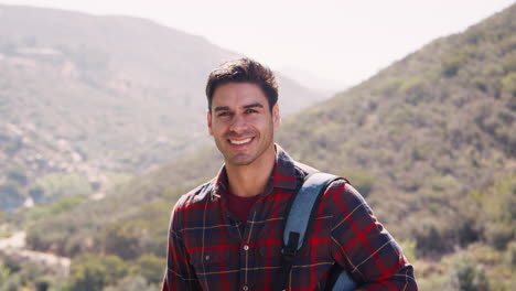 young man taking a break during a mountain hike