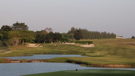 a tranquil golf course during a sunset