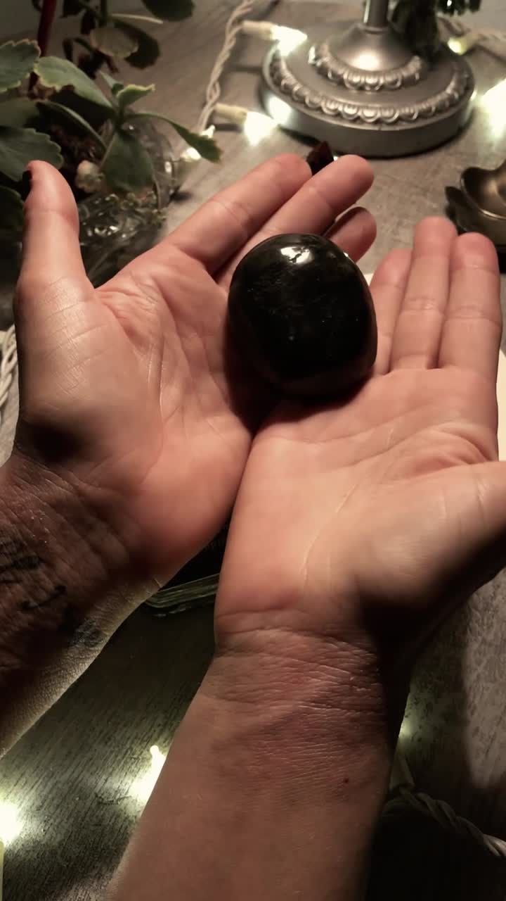 Hands Holding a Stone - Spiritual Practice