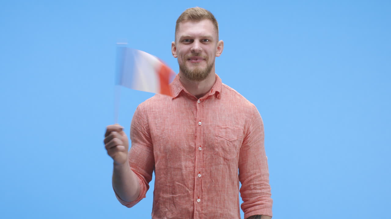 Man Holding a French Flag