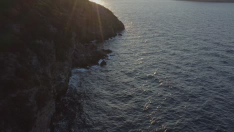 Aerial---Sunset-reveal-in-Porto-Rafti,-Greece