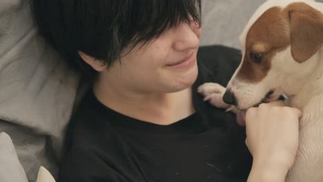 a cozy home embrace between a cute teen girl and her lively jack russell terrier