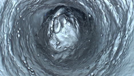 sparkling gin tonic swirling in glassware top view. carbonated cocktail funnel