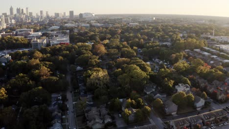 Panoramic-aerial-view-of-Atlanta-urban-cityscape-luxury-condominiums,-residential-properties,-skyline-and-skyscrapers-in-the-evening