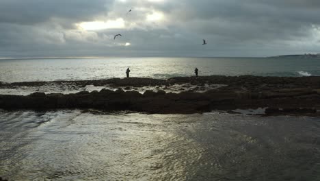 4k-footage--Fisherman-sunset-work-on-Cascais-coast-in-Portugal